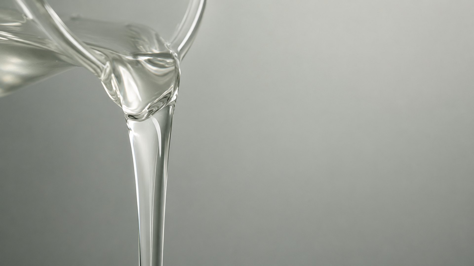 Clear viscous oleochemical raw material being poured